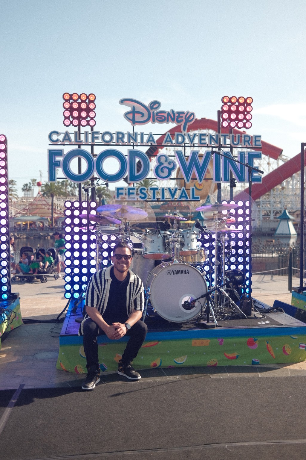 Kevin Michael Chong seated in front of his drum kit at the Disney California Adventure Food & Wine Festival