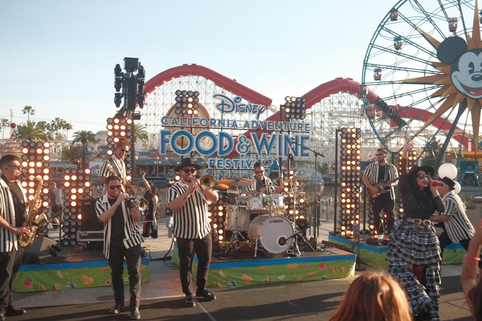 Kevin Michael Chong playing drums during a Food & Wine Festival performance at Disney California Adventure