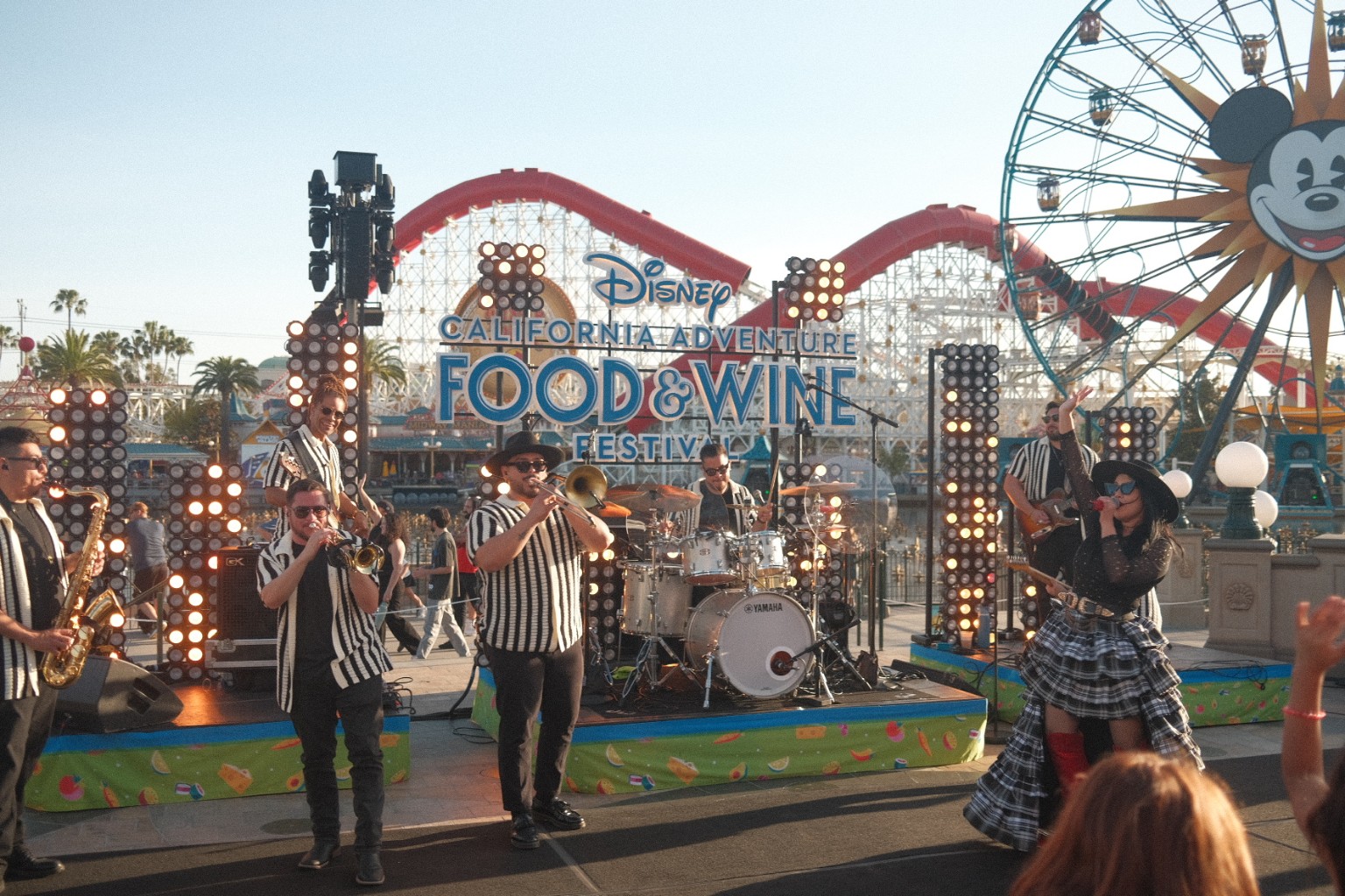 Kevin Michael Chong and the band performing at sunset during the Disney California Adventure Food & Wine Festival