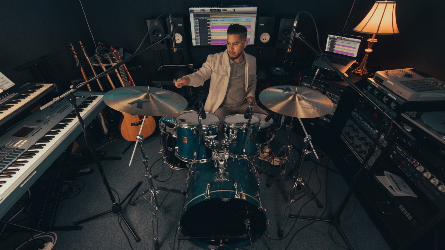 Kevin Michael Chong playing his Audix-miked drum kit in the studio