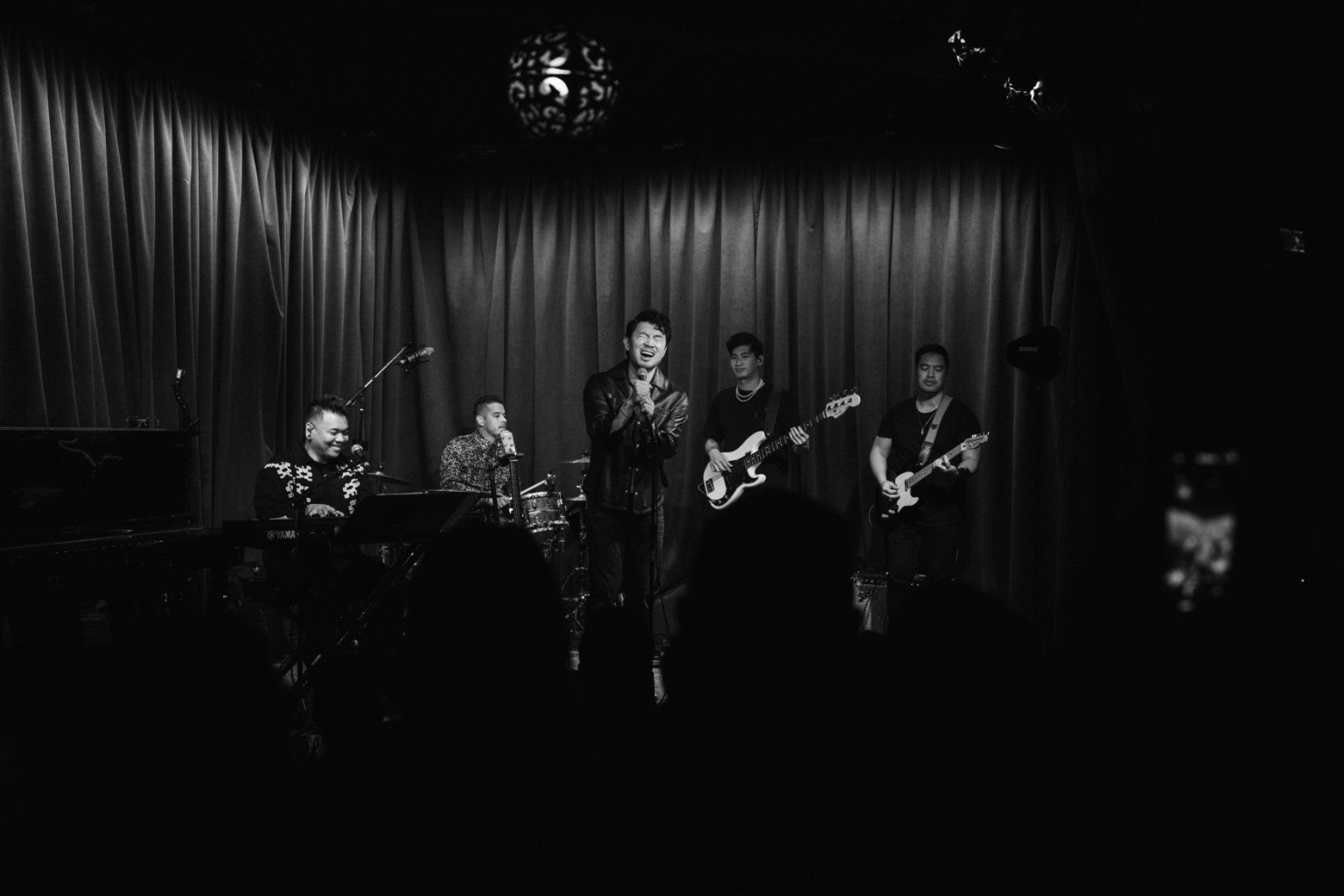 Kevin Michael Chong performing on drums with Simu Liu and the band at Hotel Café