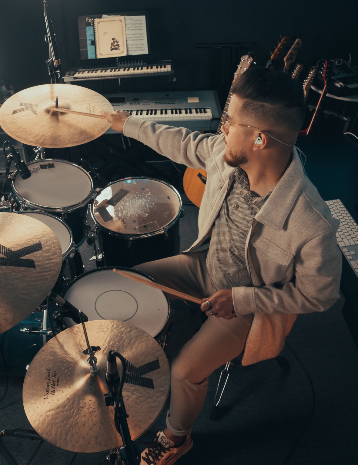Kevin Michael Chong playing drums during an Audix session